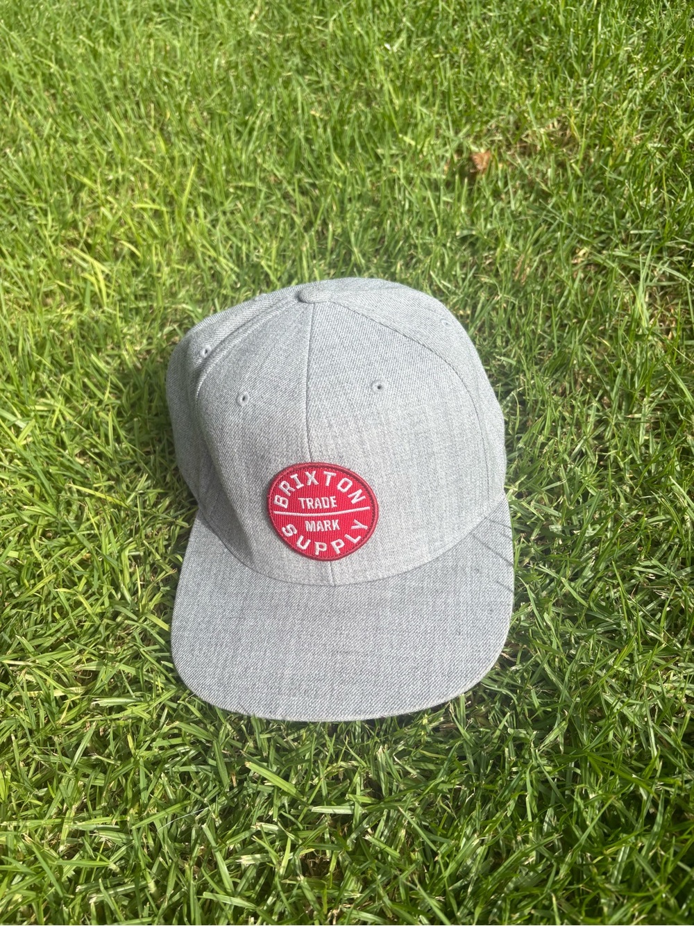 Brixton Light Gray Snapback Hat with Red Patch